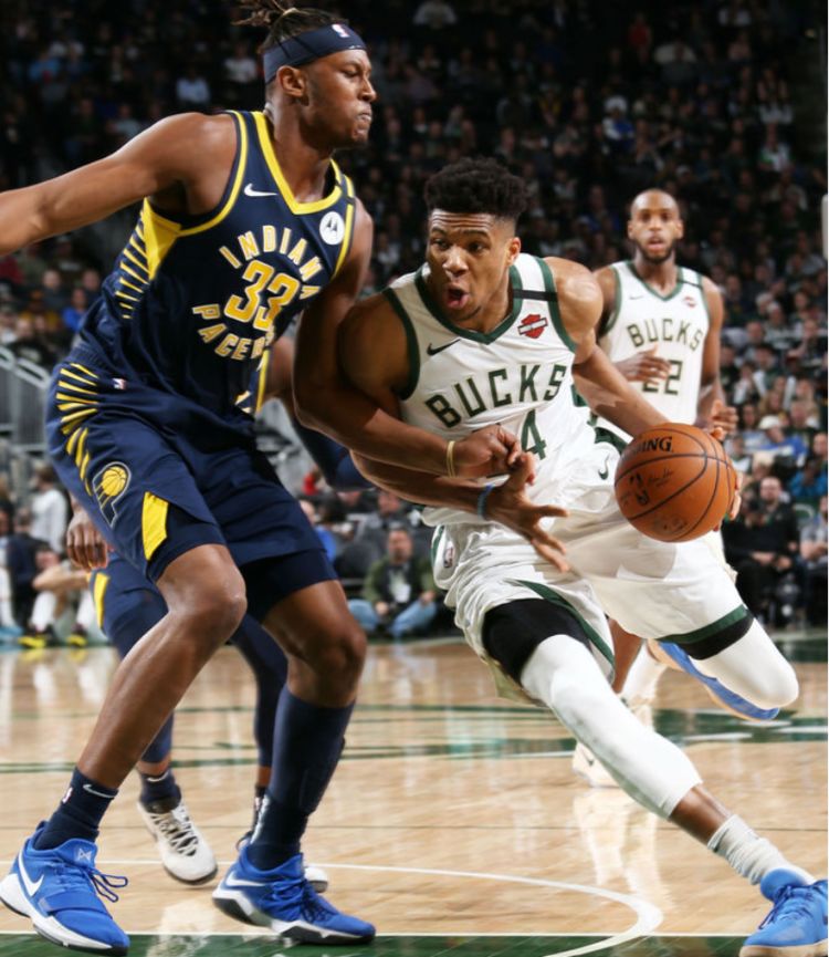 爱游戏官方-猛龙鏖战雄鹿，锡安带队取胜